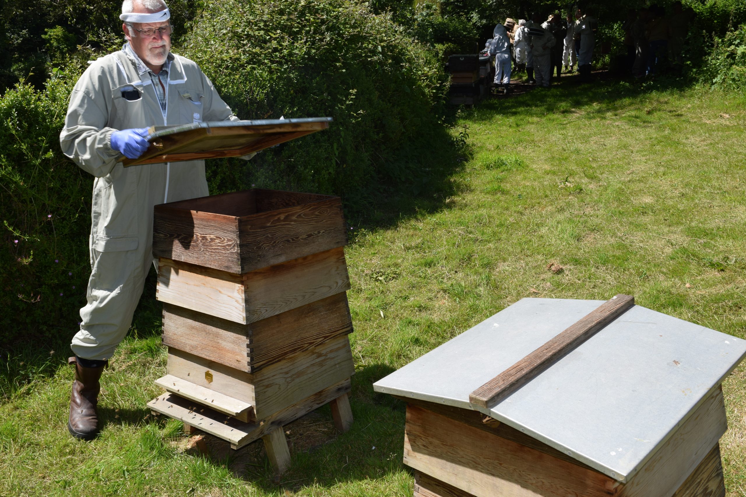 Kevin opening the first hive.
